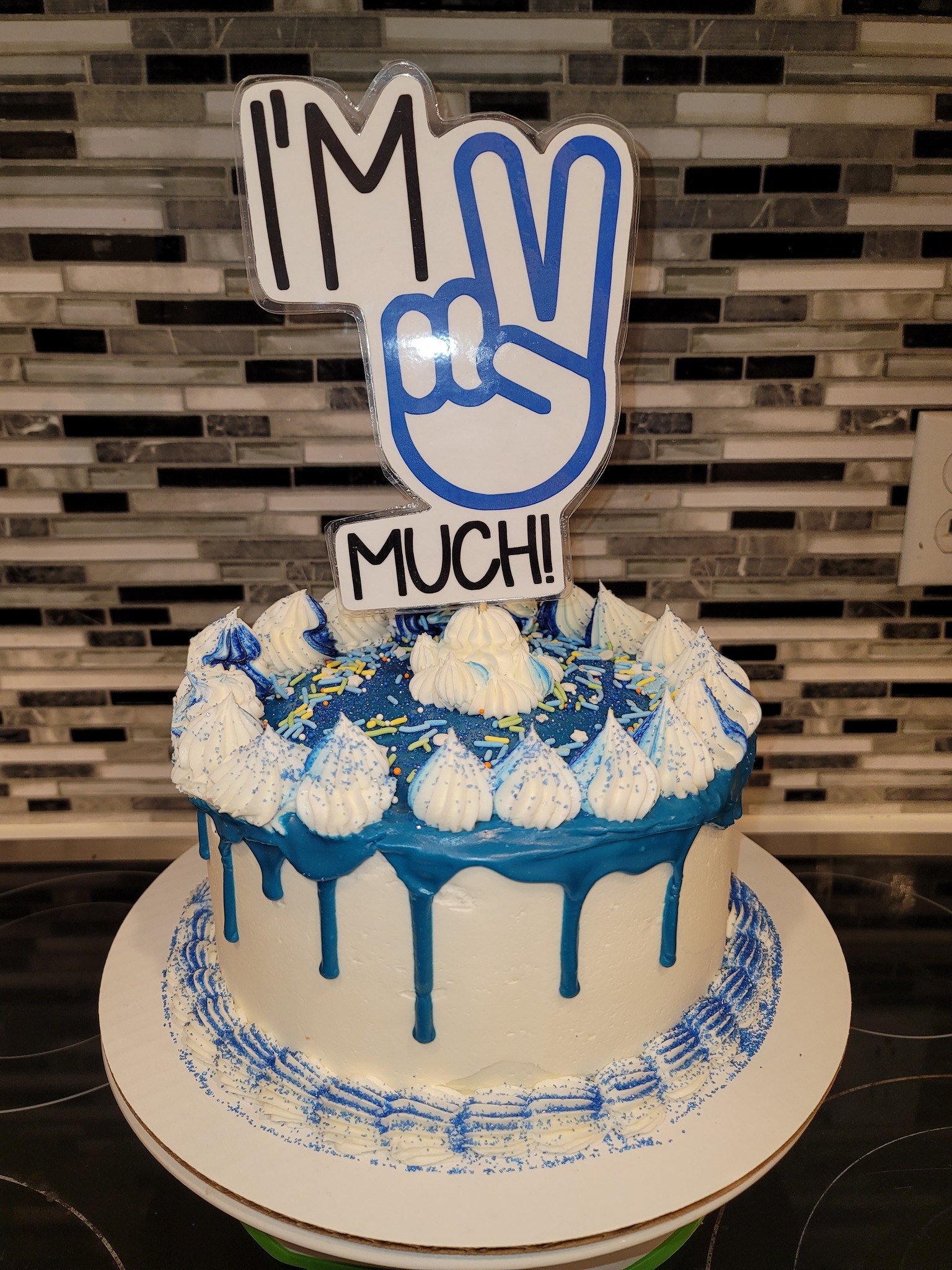 Custom white cake with blue frosting Made by Nan's Nummies