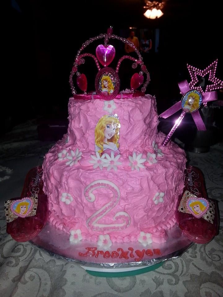 Custom pink cake with a princess on top. Made by Nan's Nummies
