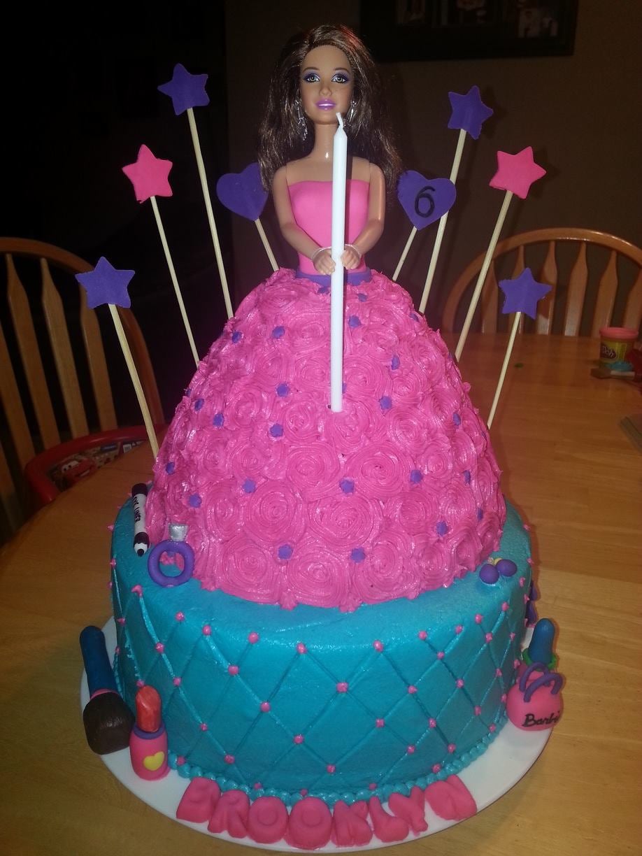 Custom cake with a barbie doll on top. Made by Nan's Nummies