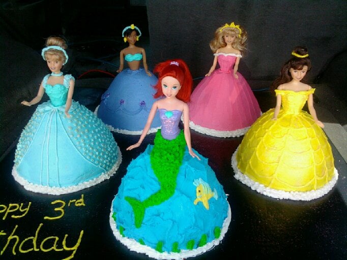 Custom birthday cake with princesses on it. Made by Nan's Nummies