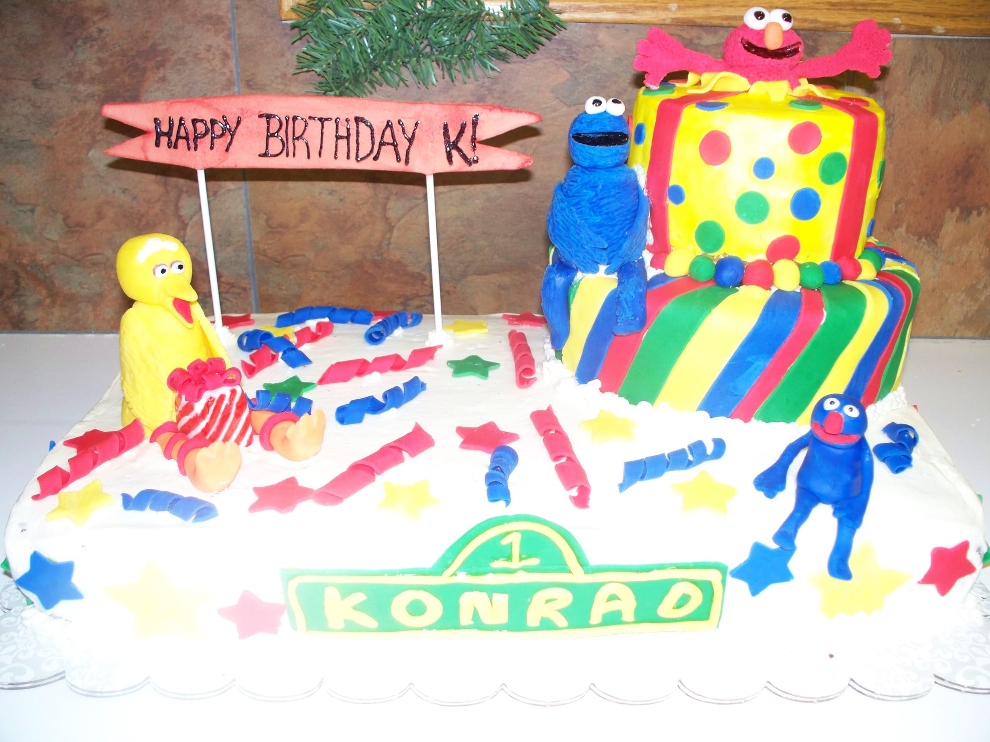Custom birthday cake with sesame street characters on it. Made by Nan's Nummies