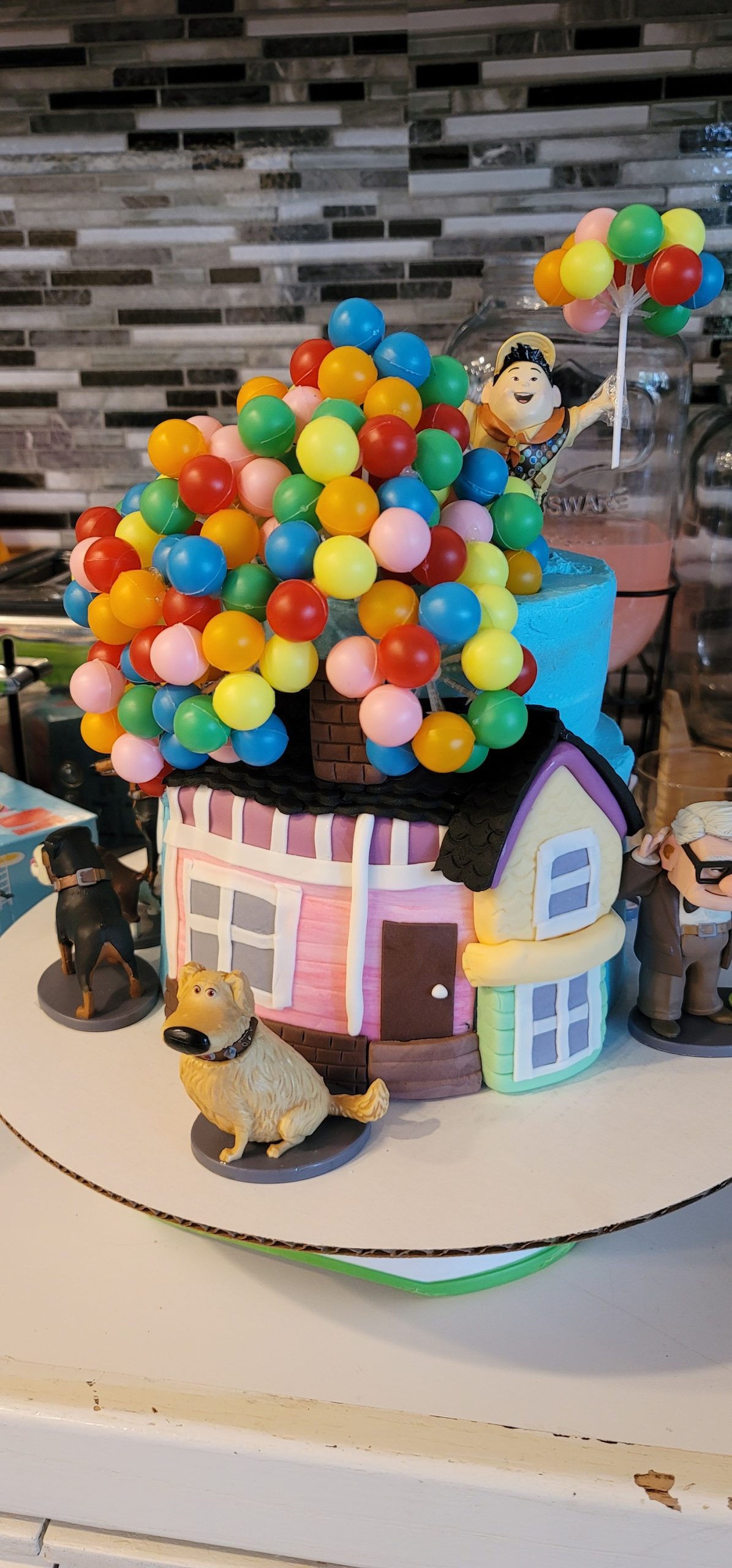 Custom cake with a house and balloons on it. Made by Nan's Nummies