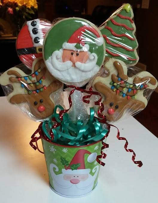 A christmas cookie bouquet with santa claus and reindeer.