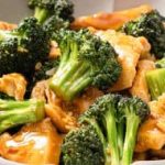 Chicken and broccoli stir fry in a bowl.