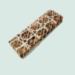 A granola bar with icing on it.