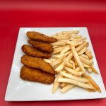 Fried chicken and french fries on a plate.