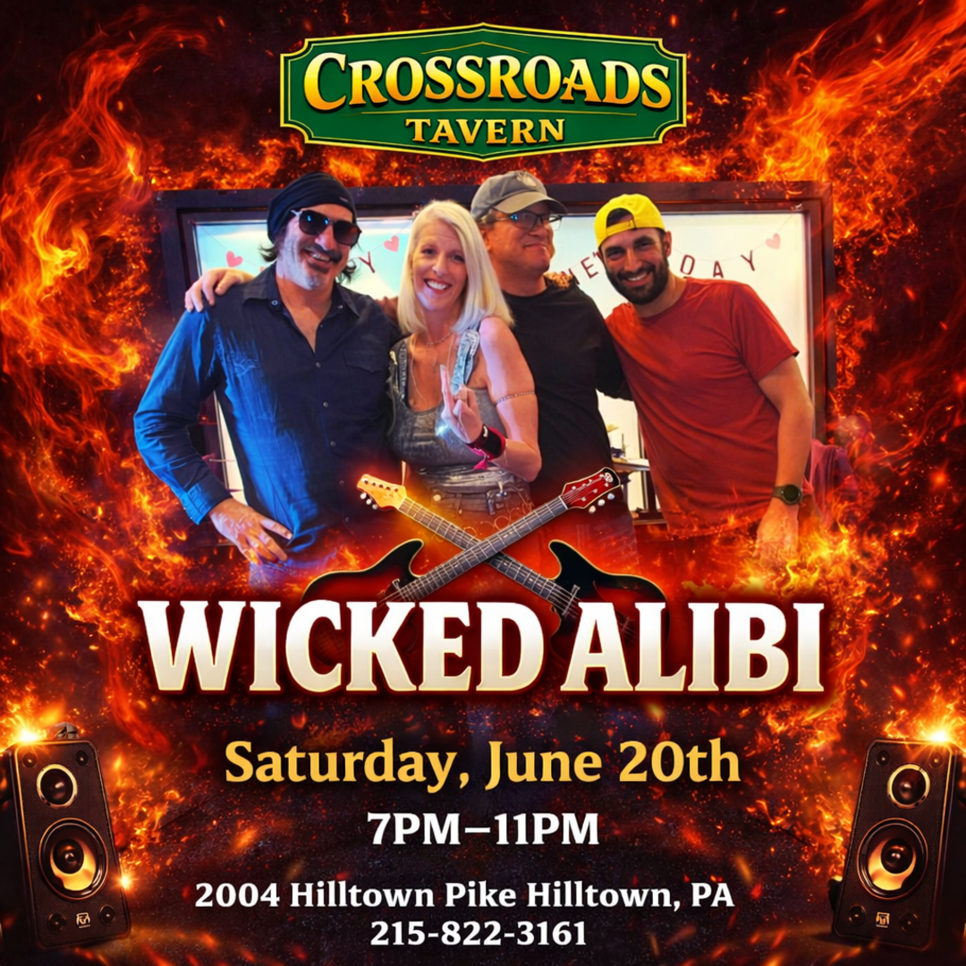 Four people pose together in front of a sign for a promotional poster for a Wicked Alibi performance at Crossroads Tavern, scheduled for Saturday, June 20th from 7-11 PM.