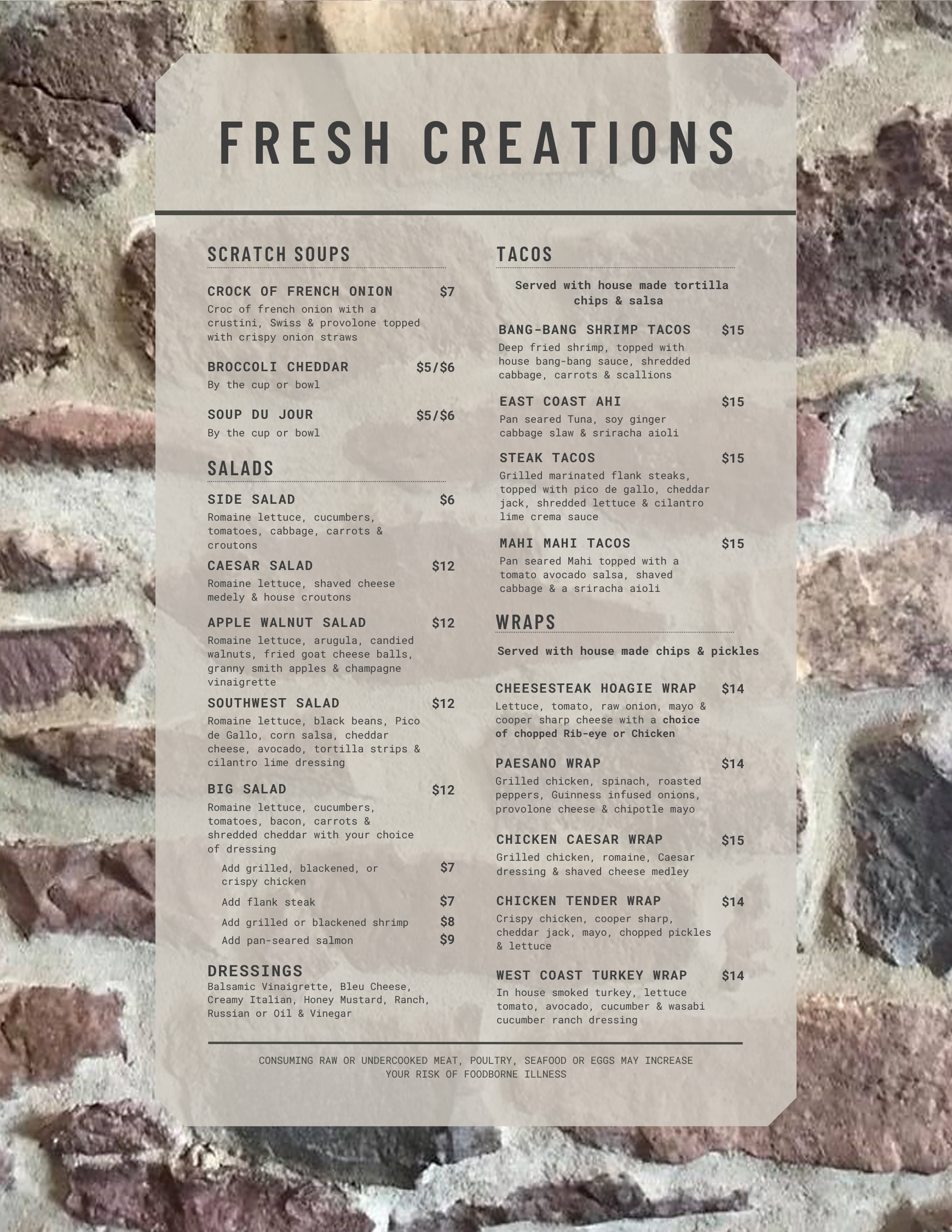 Menu titled "Fresh Creations" displayed on a stone wall, featuring scratch soups, salads, dressings, tacos, and wraps with listed prices and descriptions.