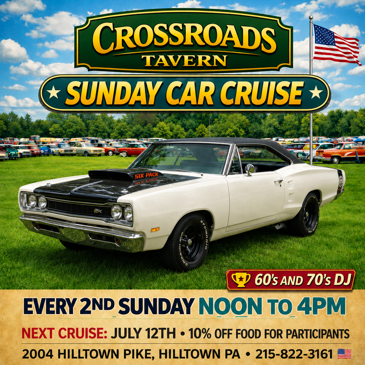A white classic muscle car is parked on grass in front of rows of vintage cars, with a sign advertising a Sunday Car Cruise at Crossroads Tavern.